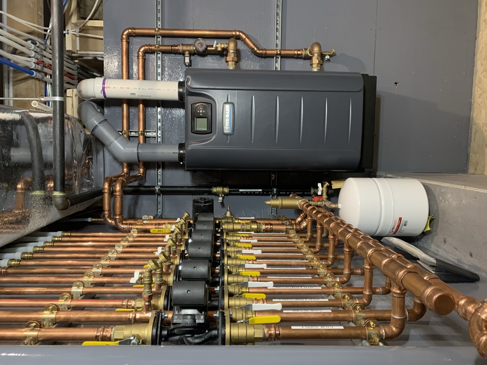 Copper heating manifold with circulator pumps